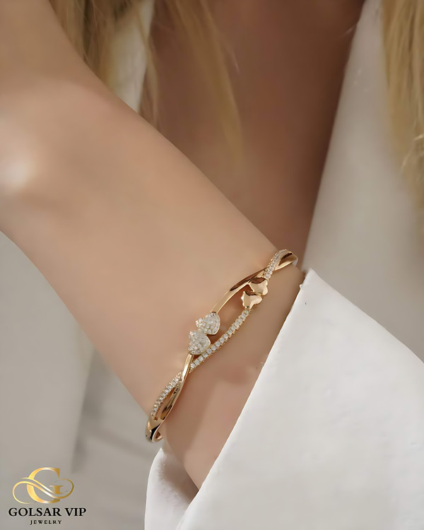 دستبند النگویی قلب پیچی ژوپینگ رنگ ثابت و ضدحساسیت آلیاژ استیل با آبکاری طلا کیفیت عالی